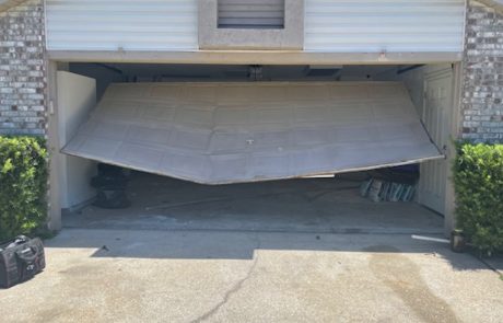 Damaged Residential Garage Door